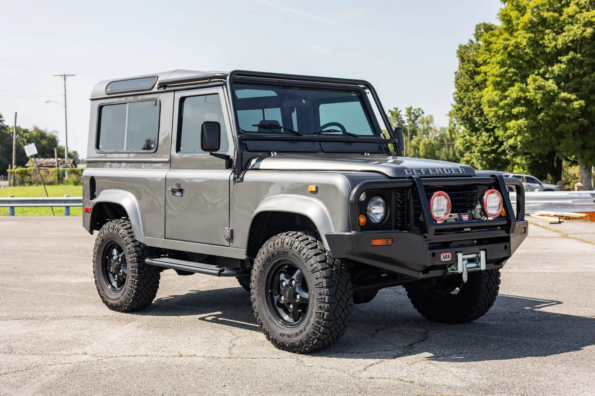 Rare gray 1997 Land Rover Defender 90 up for auction on Bring a Trailer with V8 power