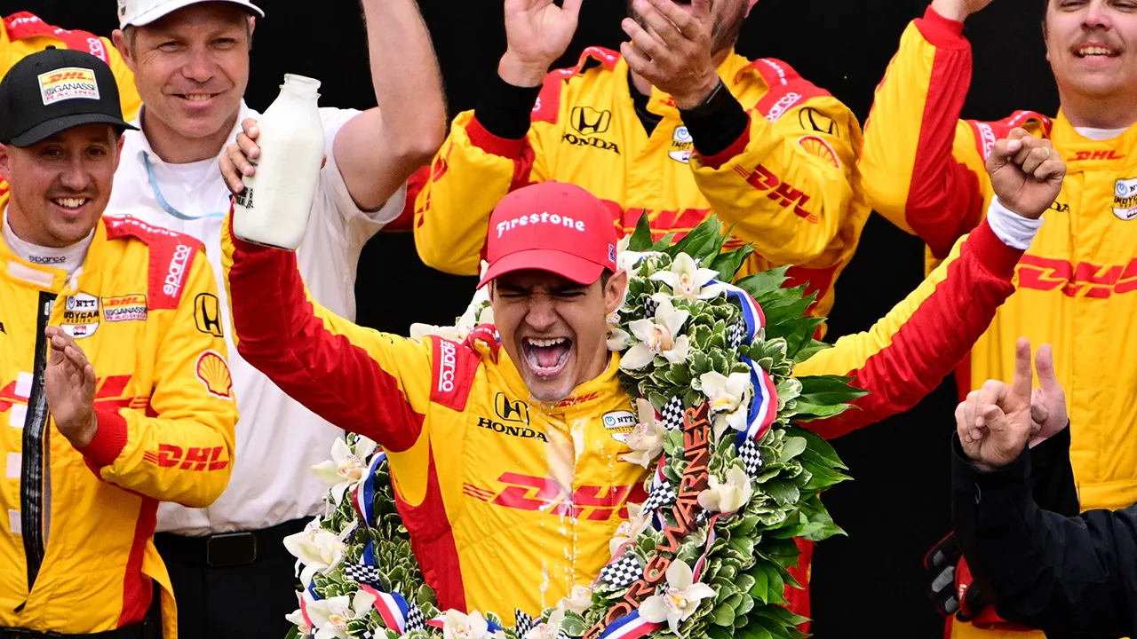 Alex Palou celebrates his fifth IndyCar championship win at the Milwaukee Mile
