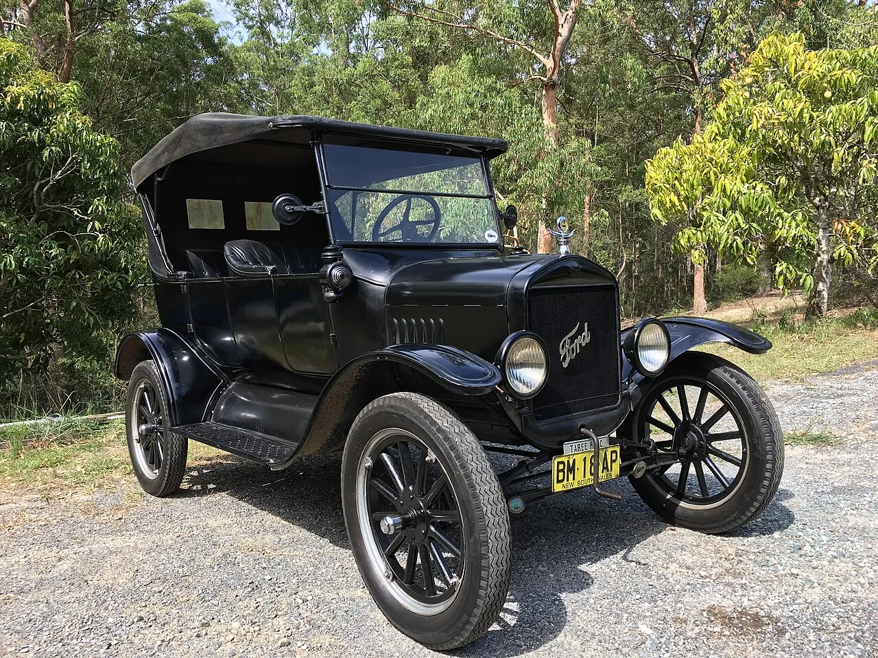 Automobile evolution from early steam inventions to modern electric cars on global roads