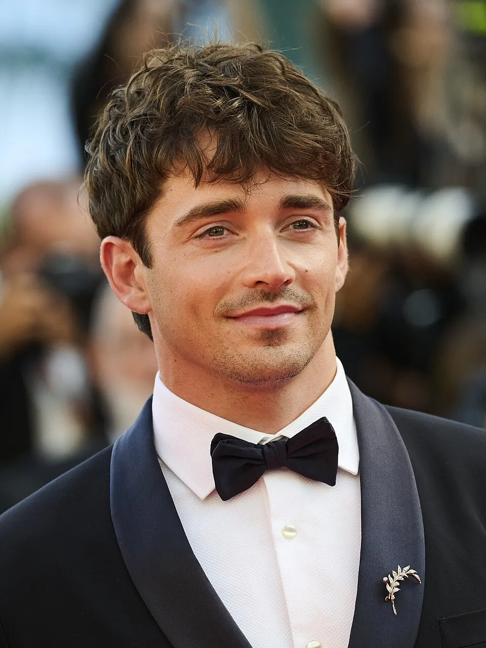 Charles Leclerc racing for Ferrari during a Grand Prix weekend
