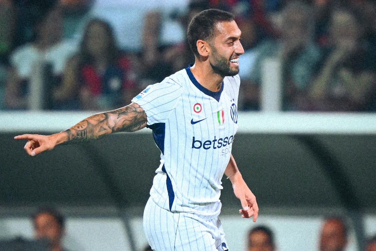 Hakan Calhanoglu celebrates scoring the decisive goal for Inter against Cagliari in Serie A