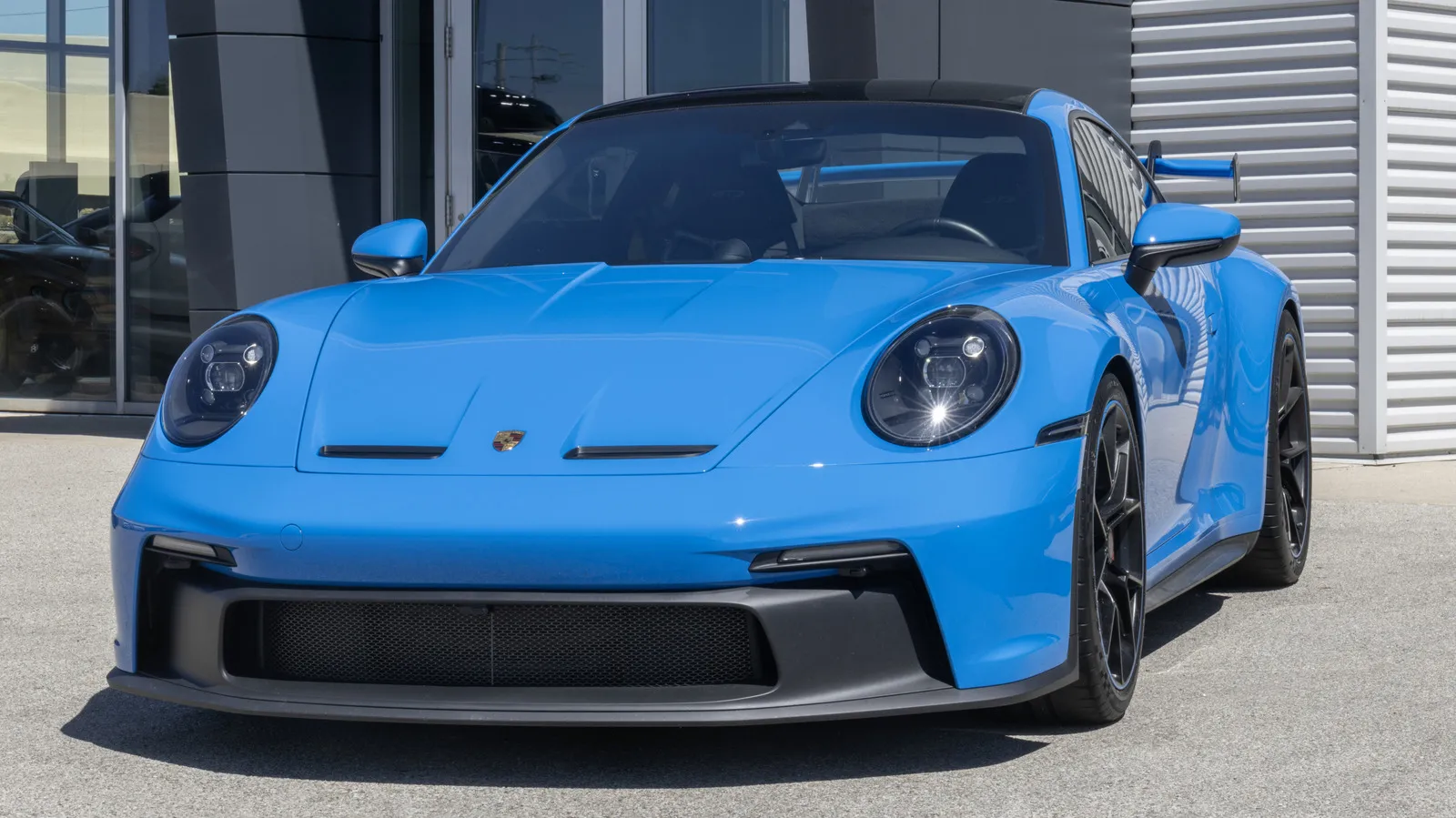 Porsche 911 GT3 outperforms the Cayman GT4 on track due to advanced aerodynamics and power