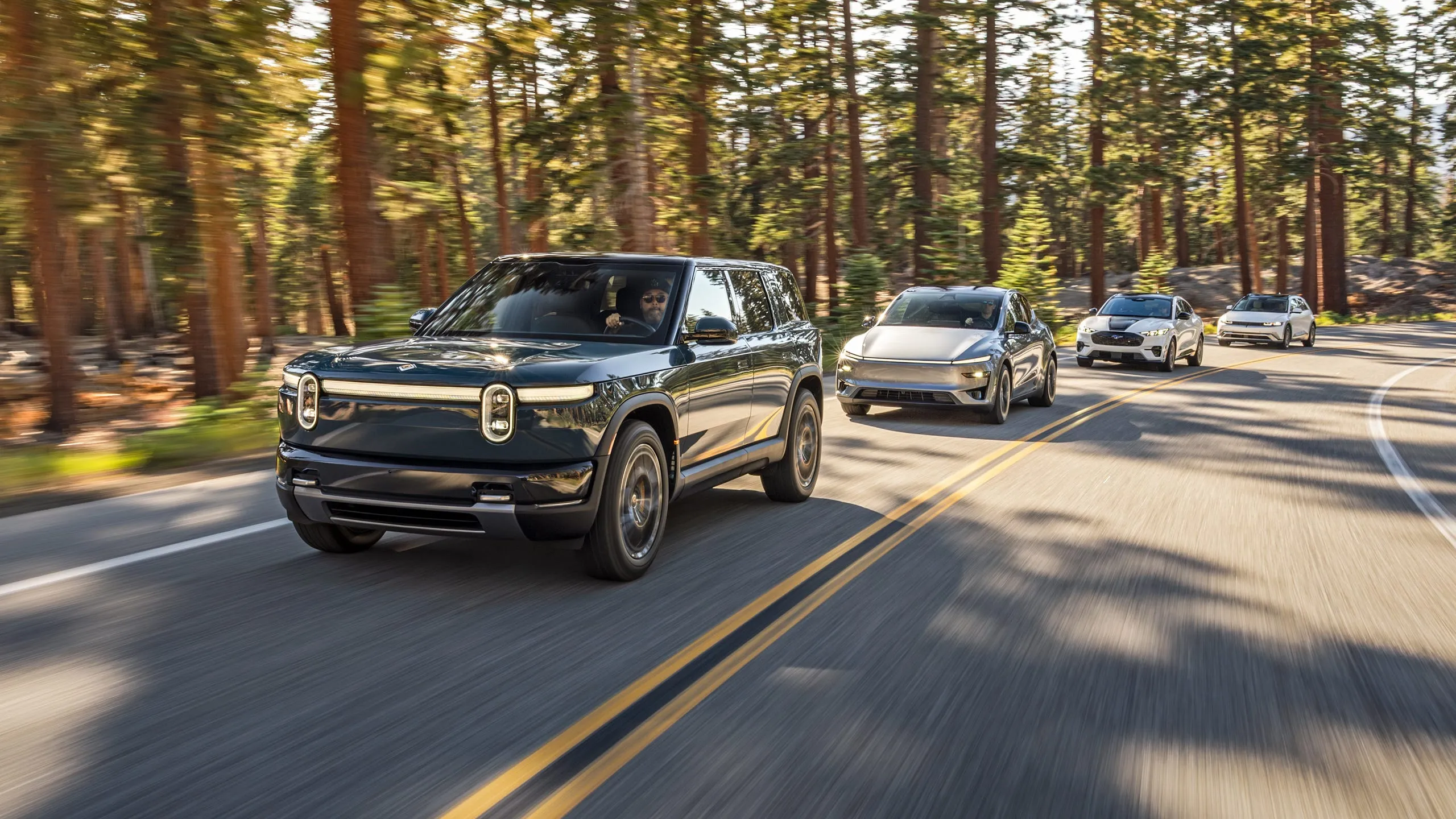 Rivian R2 competes against Tesla, Hyundai, and Ford electric SUVs in a road trip test