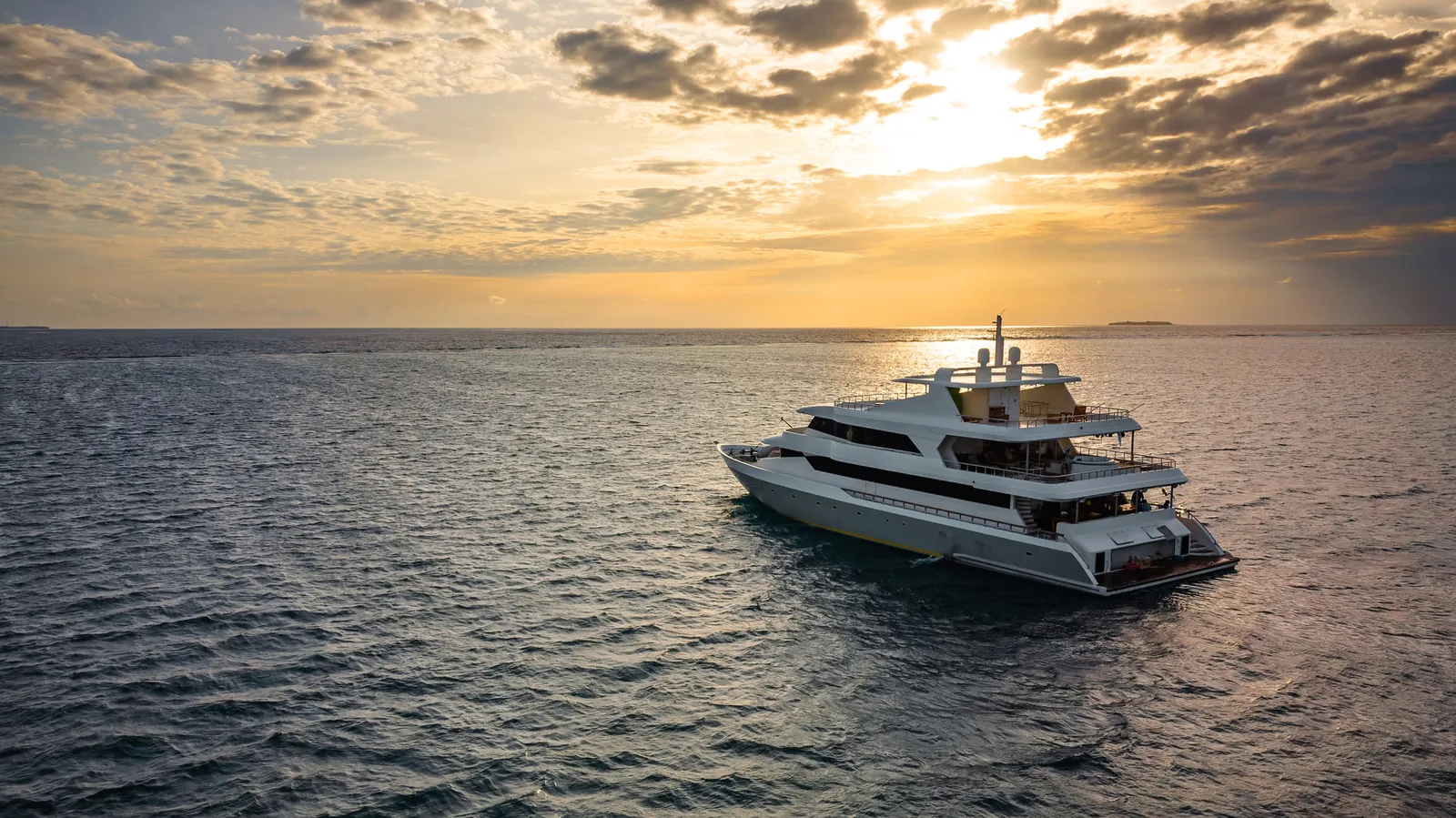 Luxury yacht cruising the open sea under international maritime safety regulations and the 12-person rule