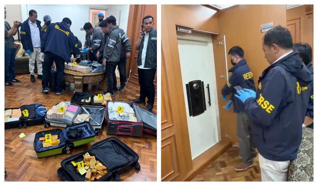 Petugas kepolisian mengamankan barang bukti emas batangan dan koper uang hasil penggeledahan rumah di Sentul